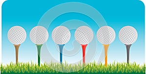 Golf balls on tees photo