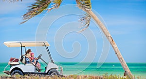 Golf cart at tropical beach