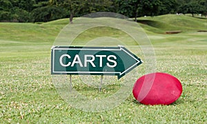 The golf carts sign on a golf field