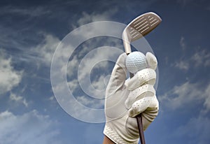 Golf club against a blue sky