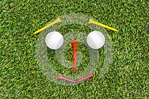 Golf club and ball in grass