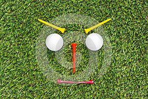 Golf club and ball in grass