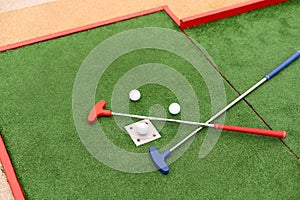 golf club, ball and hole