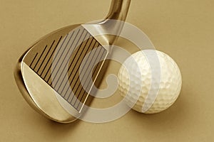 Golf club and ball sepia style image.