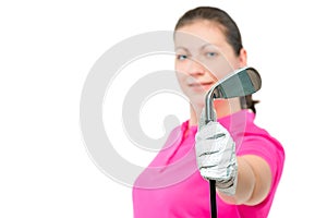 golf club in hand a golfer close up in focus