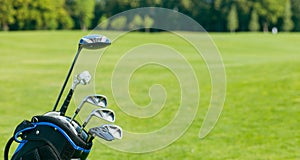 Golf clubs in a golf bag isolated. Set of golf clubs for a golfer. Copy Space. green Background. Close-up