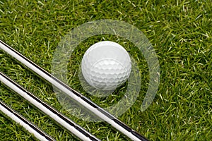 Golf clubs or golf irons with a golf ball