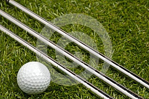 Golf clubs or golf irons with a golf ball