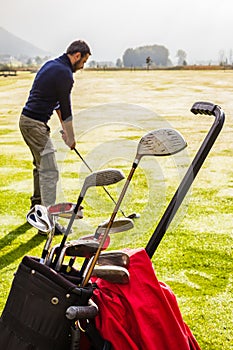 Golf clubs and golf player