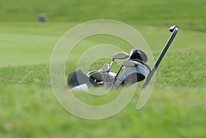 Golf Clubs green , bag on the   fairway