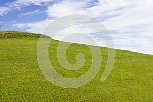 Golf course in Belek. Green grass on a field. Blue sky, sunny da