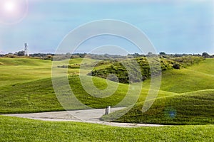 Golf course in Belek. Green grass on field. Blue sky, sunny day