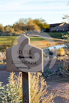Golf course directional sign to tee and clubhouse