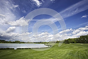 Golf course fairway and fantastic sky photo