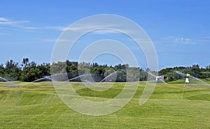 Golf course grass being watered, Rio