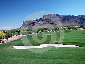 Golf Course Green Belt with Bunker and Mountains