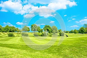 Golf course. Green field with fresh grass and blue sky