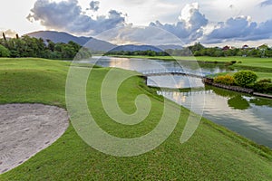 Golf course green grass field and lagoon