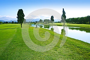 Golf course green grass field lake reflection