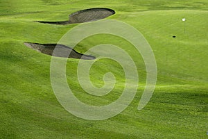 Golf course green grass hill field with holes