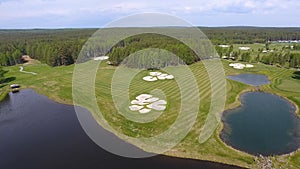 Golf course on a Sunny day, an excellent Golf club with ponds and green grass, view from the sky