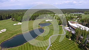 Golf course on a Sunny day, an excellent Golf club with ponds and green grass, view from the sky