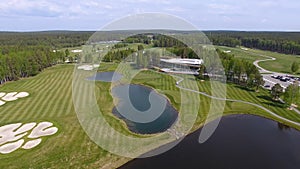 Golf course on a Sunny day, an excellent Golf club with ponds and green grass, view from the sky