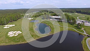 Golf course on a Sunny day, an excellent Golf club with ponds and green grass, view from the sky