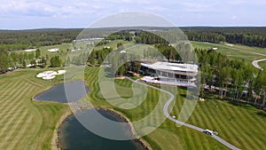 Golf course on a Sunny day, an excellent Golf club with ponds and green grass, view from the sky