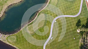 Golf course on a Sunny day, an excellent Golf club with ponds and green grass, view from the sky