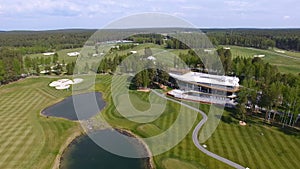 Golf course on a Sunny day, an excellent Golf club with ponds and green grass, view from the sky