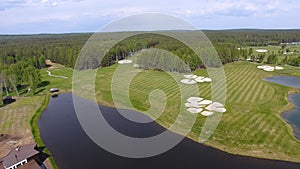 Golf course on a Sunny day, an excellent Golf club with ponds and green grass, view from the sky