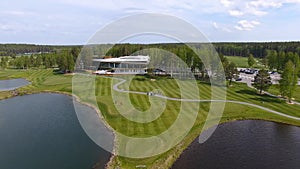 Golf course on a Sunny day, an excellent Golf club with ponds and green grass, view from the sky