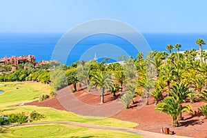 Golf course in tropical landscape of Tenerife island near San Juan town, Spain