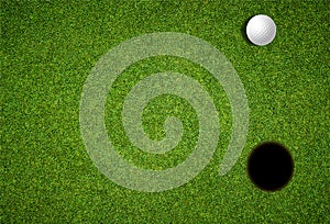 Golf day invitation, looking down on lawn with golf ball and hole