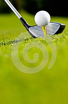 Golf driver and ball on tee