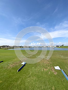 Golf Driving Range Grass Tee with Golf Balls and Blue Skies. In Florida Sun