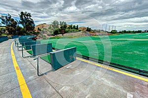 Golf driving range stations above ground