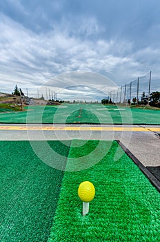 Golf driving range stations above ground
