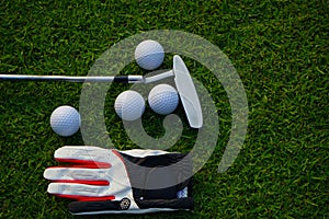 Golf equipment on green grass