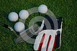 Golf equipment on green grass