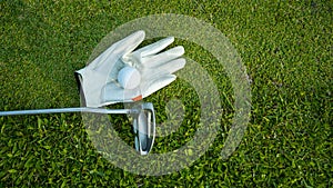 Golf equipment on green grass, close up view