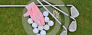 Golf equipment on green grass on golf course