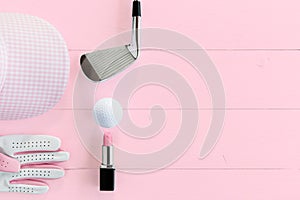 Golf equipment for ladies on wooden surface in pink, top view