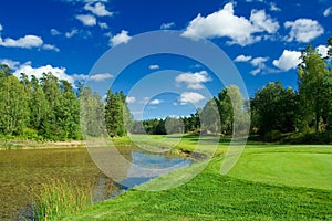 Golf fairway along the pond