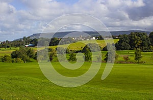 A golf fairway and green in the parkland course in the Roe river valley near Limavady in Northern Ireland