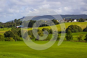 A golf fairway and in the parkland course in the Roe river valley near Limavady in Northern Ireland with the magnificent Bie