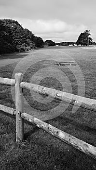 Golf fence bench grass sky