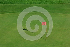 Golf field with red flag