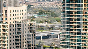 Golf field timelapse from top at day time with traffic on sheikh zayed road.